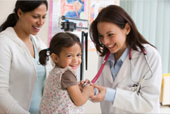 photo of female doctor with child