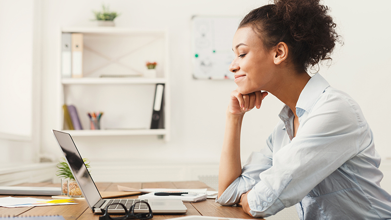 Woman looking at laptop