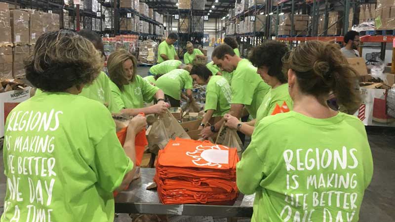 Volunteers packing boxes