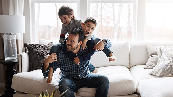 father playing with his two children