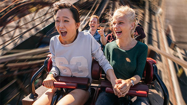 two female friends on a roller coaster