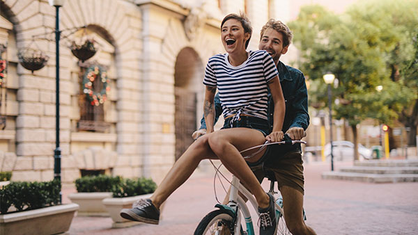 couple riding on a bicycle
