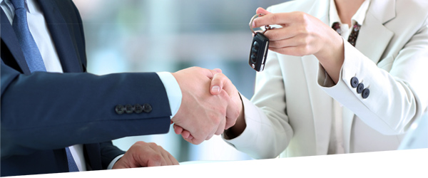 woman handing man car keys
