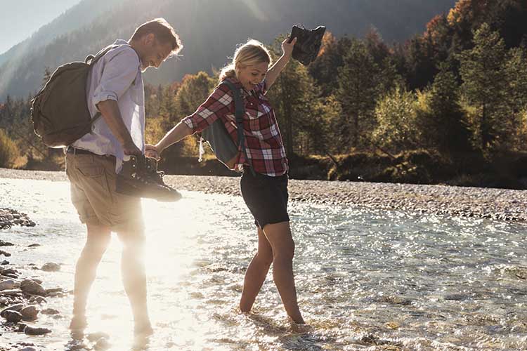 couple walking in river