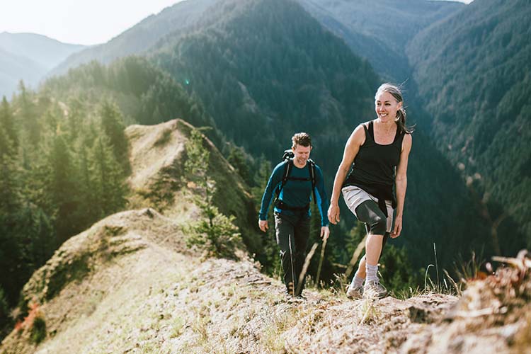mature couple hiking a mountain