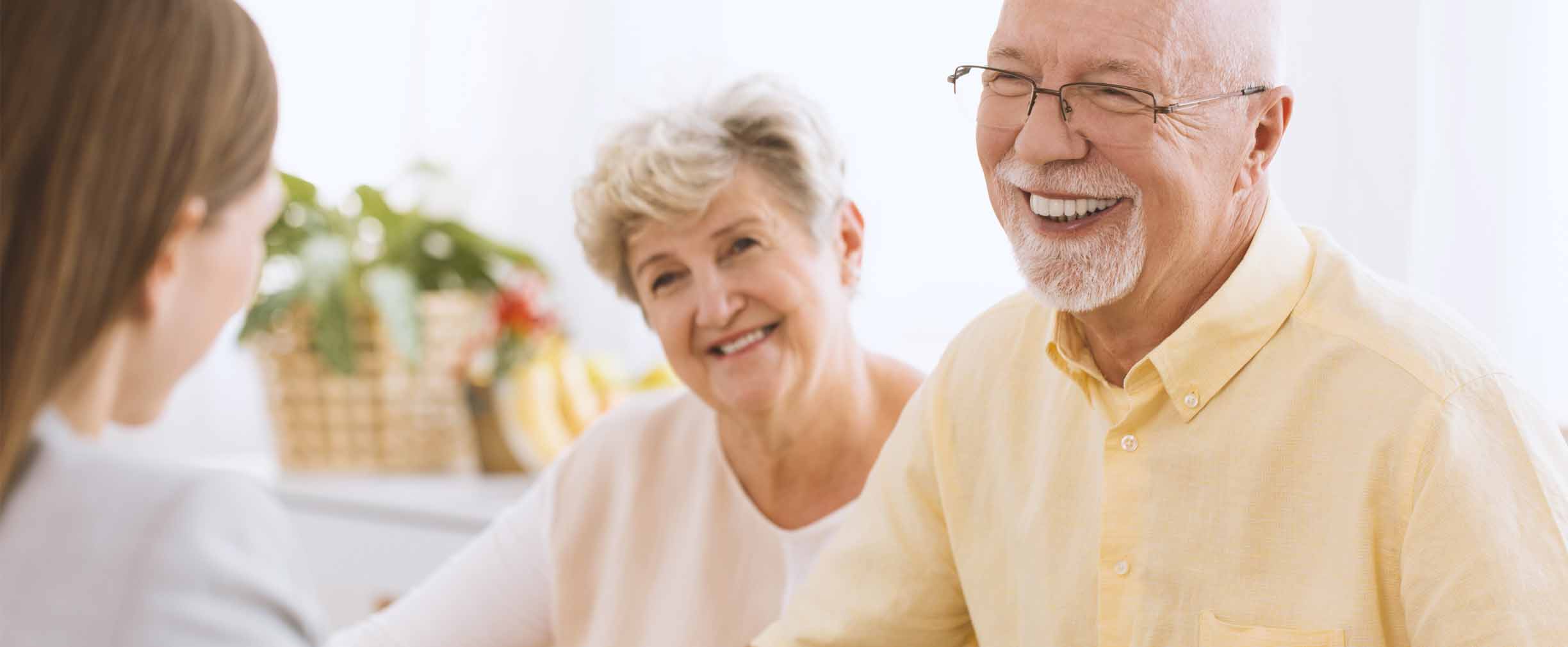 mature couple reviewing estate plan with wealth advisor