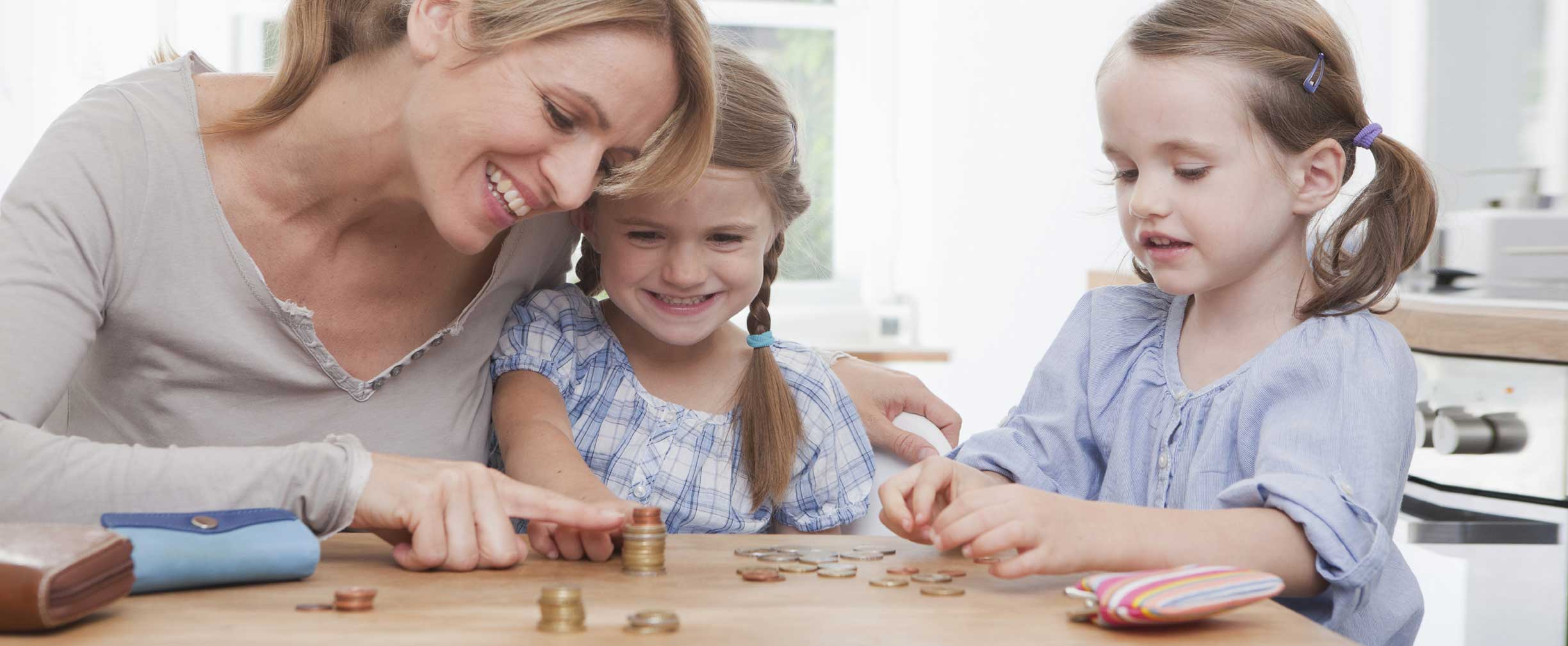 Mom teaching kids about money 